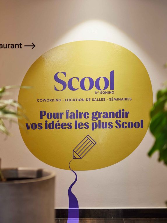Wall with Scool lettering to indicate business center rooms in the Hotel du Pin, Nice